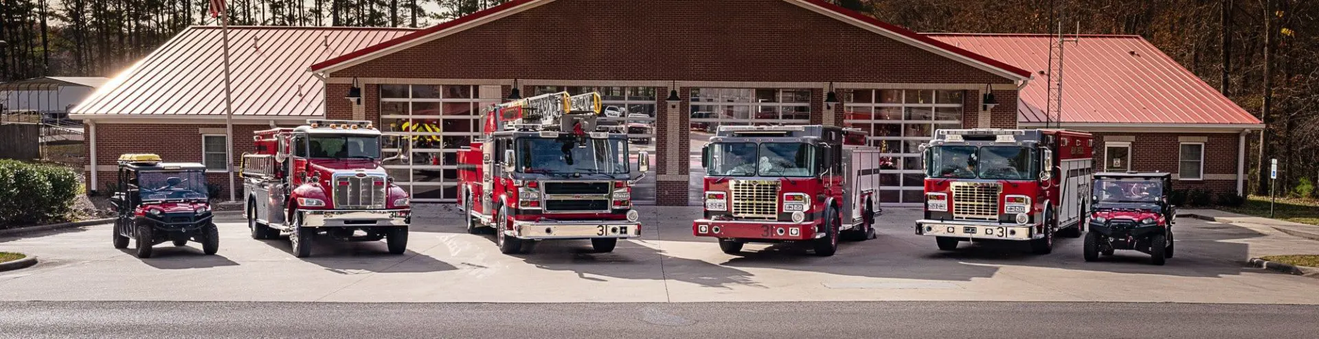 Closeup image of the side of a fire truck showing gauges and levers used in the vehicle control systems.